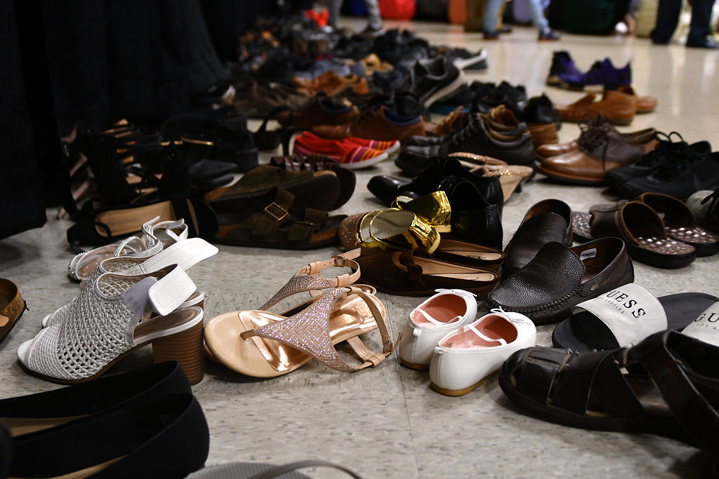 Hundreds of shoes cover the floor during prayer